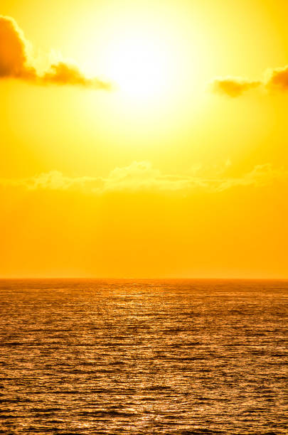 istock The sun is setting over the ocean, casting a warm glow on the water 2192794273