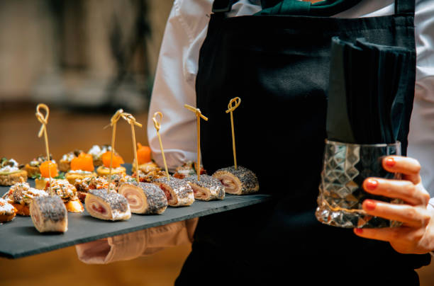 istock Waiter carrying plates for canape service 2192794547