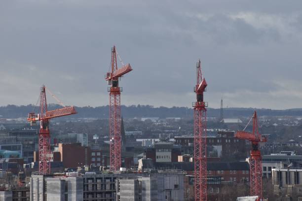 istock Cranes towering over a city skyline, symbolizing urban growth and construction progress. 2192797265