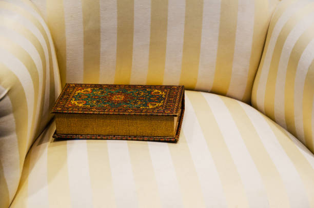Out of focus image of old books on wooden table