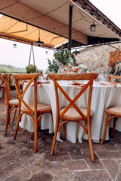 istock Charming outdoor dining setup with floral decor. 2192798957