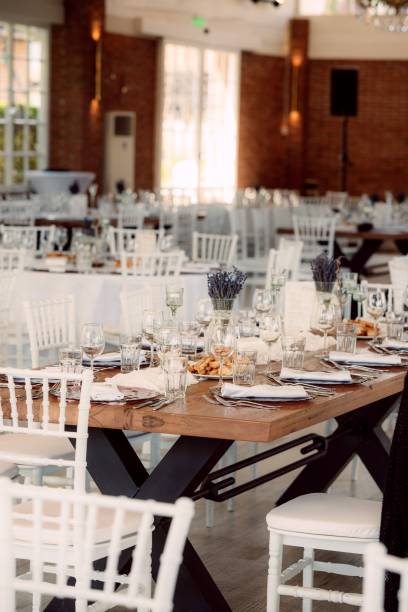 istock Elegant banquet hall setup with formal table settings. 2192798998