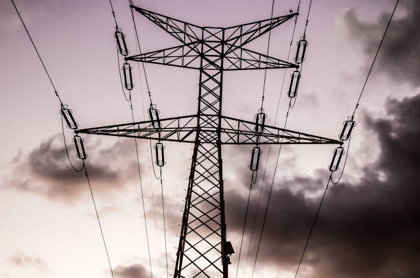 istock A tall power line tower with a cloudy sky in the background 2192799065