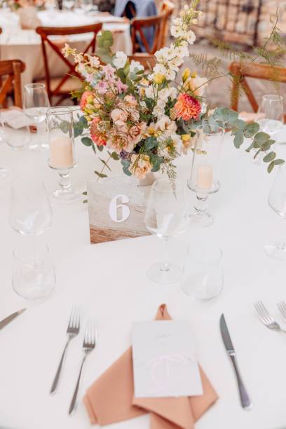istock Elegant wedding table setting with floral centerpiece. 2192799250