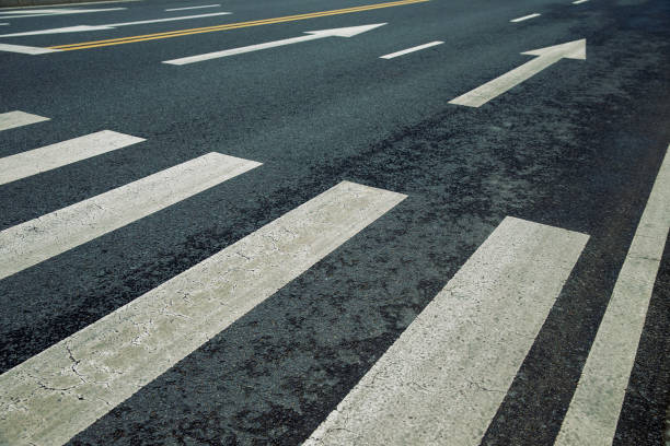 istock Arrow symbol on asphalt road 2192800055