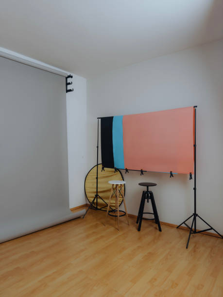 istock Modern photo studio setup with backdrops and reflectors ready for shooting 2192805168