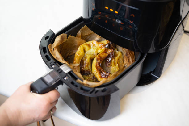 istock Cooked peppers in air fryer close up 2192806090