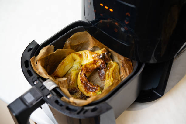 istock Cooked peppers in air fryer close up 2192806105
