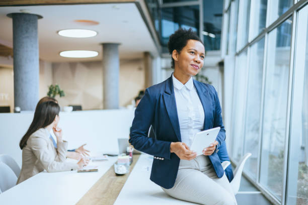 istock Content businesswoman with digital tablet in office 2192806812