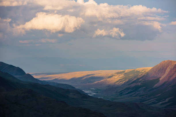 Breathtaking view of the mountains and valley in a national park. Green trees covering the mountains.