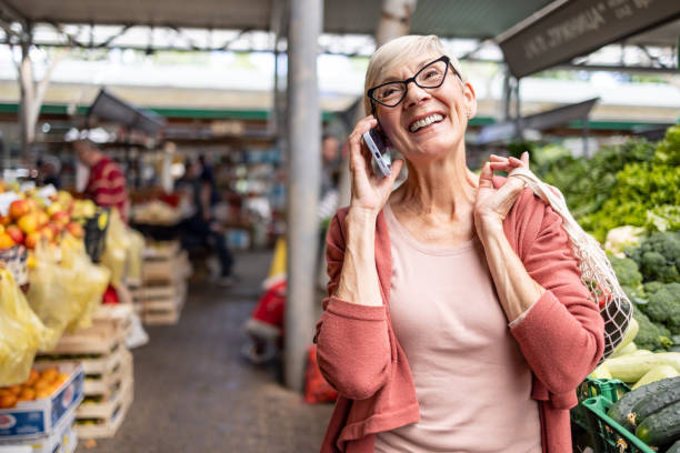 istock Woman making a call in a vegetable market 2192806903