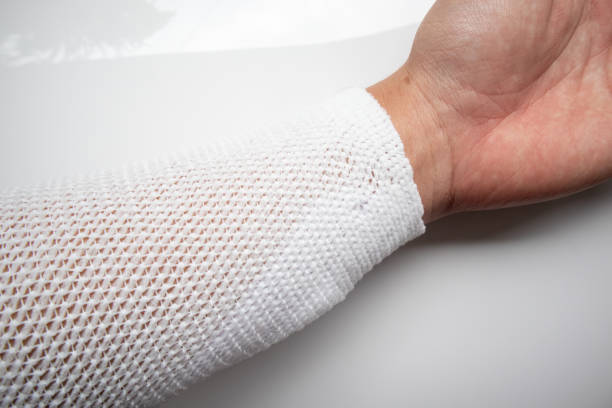 istock A wound on the hand wrapped with white medical gauze. 2192806931