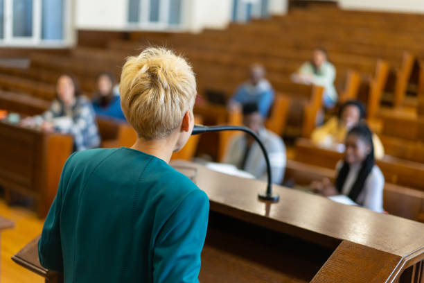 istock Over the shoulder view of a university tutor teaching her class 2192807030