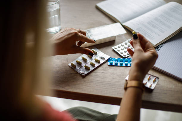 Young woman taking her meds