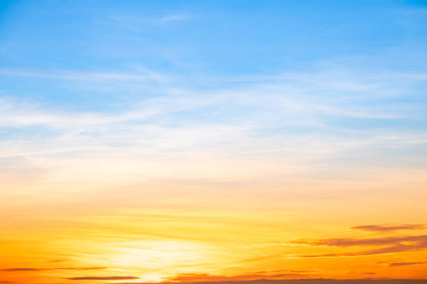istock Sky,sunset, beautiful , luxury soft gradient orange gold clouds and sunlight on the blue sky perfect for the background, Sunrise on morning or everning in winter warm time ,Twilight summer,silhouette 2192811842