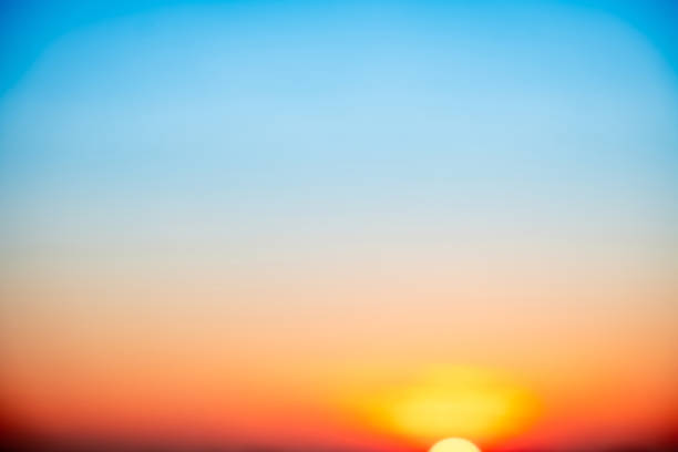 Sky,sunset, beautiful , luxury soft gradient orange gold clouds and sunlight on the blue sky perfect for the background, Sunrise on morning or everning in winter warm time ,Twilight summer,silhouette