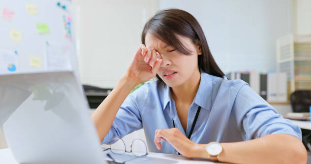 istock woman eyes pain at work 2192813042