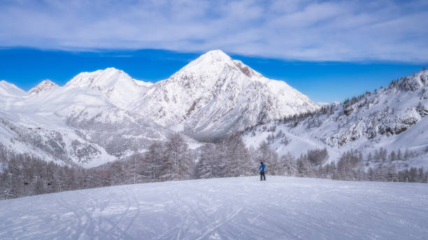 istock Experience an absolutely breathtaking Winter Landscape featuring stunning SnowCapped Mountains against a Clear Blue Sky 2192816263