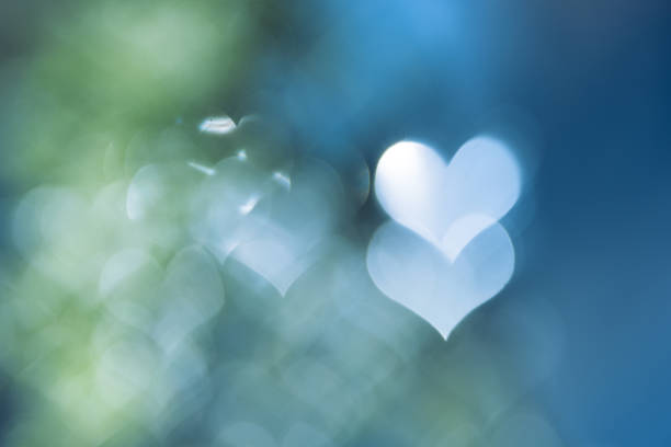 Love Valentine's day background. Glittering hearts bokeh background