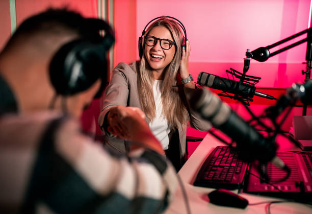 istock Female podcaster making podcast with young man from her studio. 2192819231