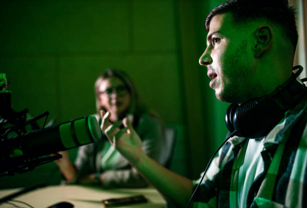 istock Male podcaster making podcast with young woman from his studio. 2192819234