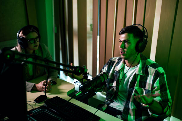 istock Male podcaster making podcast with young woman from his studio. 2192819267