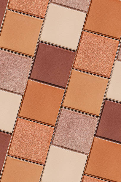 istock Swatches eyeshadow refills as minimal graphic pattern. Matte and glitter pans beige brown copper shade, detailed texture, sun light, minimal trend cosmetics background, beauty product, eye makeup 2192822130