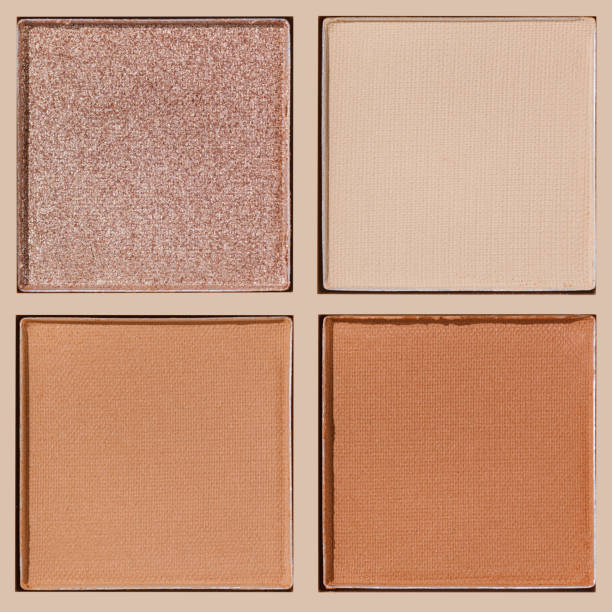 istock Neutral Eyeshadow Palette with Matte and Shimmer texture, natural colored shades on beige. Set of eyeshadow refills, Top view of four Swatches Eyeshadow makeup for cosmetic, makeup, beauty concept 2192822138
