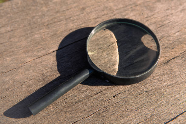 istock magnifying glass on the wooden table 2192822905