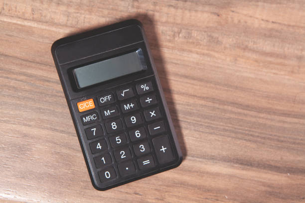 istock calculator on wooden background.business concept 2192822955