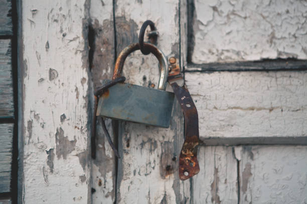 istock old padlock in a rusty door of a house 2192823048