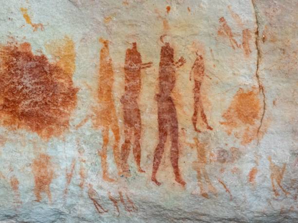 istock Ancient rock art with human figures in earthy tones. 2192823228