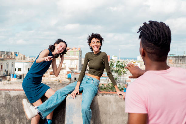 istock Young friends talking outdoors in Havana, Cuba 2192824752