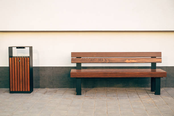 istock Bench and trash can with ashtray on the street 2192824879