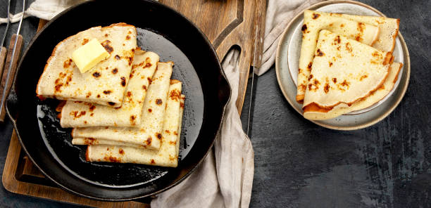 istock Crepes with sweet toppings on dark background. 2192828386