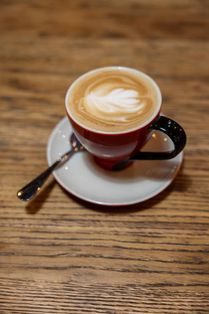 istock A cup of cappuccino on the rustic oak table. 2192828837