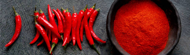 istock Red chili or chilli cayenne pepper on dark background. 2192829635
