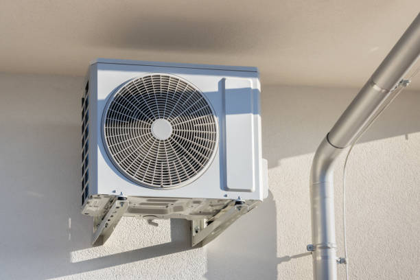 istock Air source heat pumps installed  under a roof modern family house under construction 2192835811