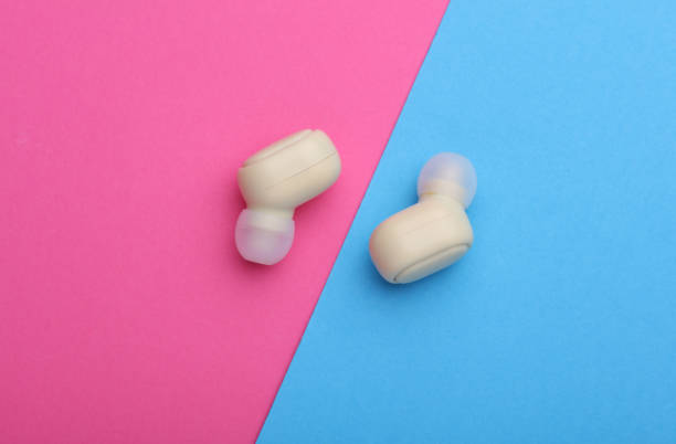 istock Wireless vacuum Earpbuds on a pink blue background 2192836612