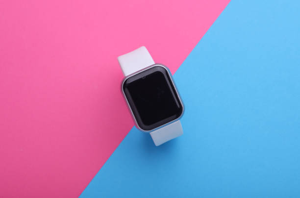 istock Modern smart watch on pink blue background 2192836716