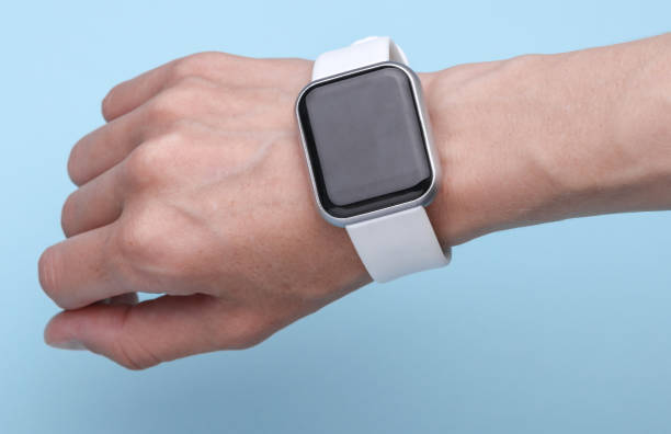 istock Smart watch on the wrist, blue background 2192837015