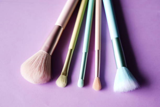 abstract image of make up brushes on pink