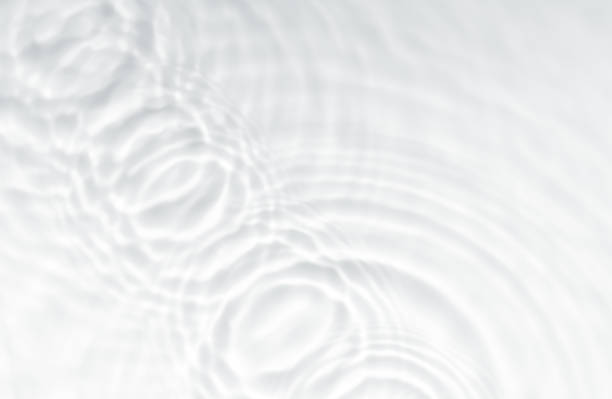 istock White water background with ripples surface on pool for spa, cosmetic product.Blurred transparent with light effect on clear calm water texture waves with shining on circle, splashes swimming pool 2192839226
