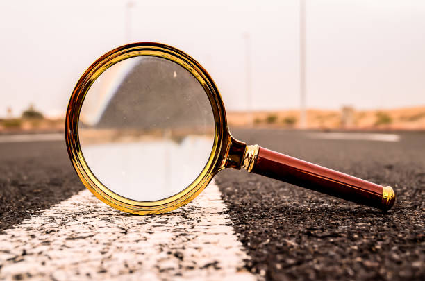 istock A magnifying glass is on the road 2192842209