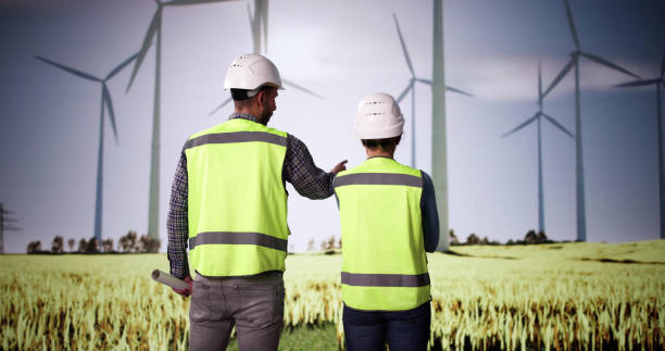 istock Wind Turbine Engineers At Green Energy Farm 2192842714