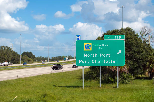 istock Interstate freeway exit sign in Florida, USA. I-75 highway interchange with direction to North Port and Port Charlotte 2192844475