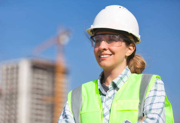 istock Smiling female civil engineer at construction site. 2192844562