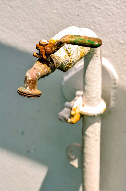 istock A rusty faucet is attached to a white pipe 2192844803