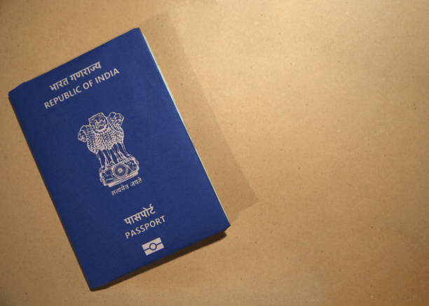 istock Indian traveling document placed on brown surface backdrop with space. Indian passport concept design backdrop 2192844965