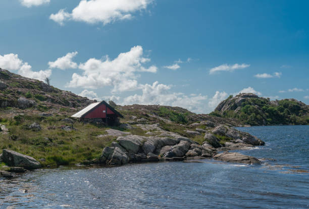 Walking path along the fjord on Skernoya island in southern norway